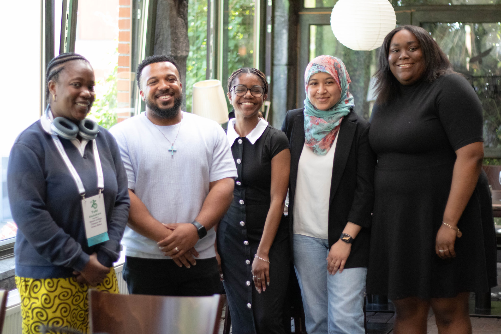 Members of the Black Mental Wellness Research Lab standing together and smiling at a research conference