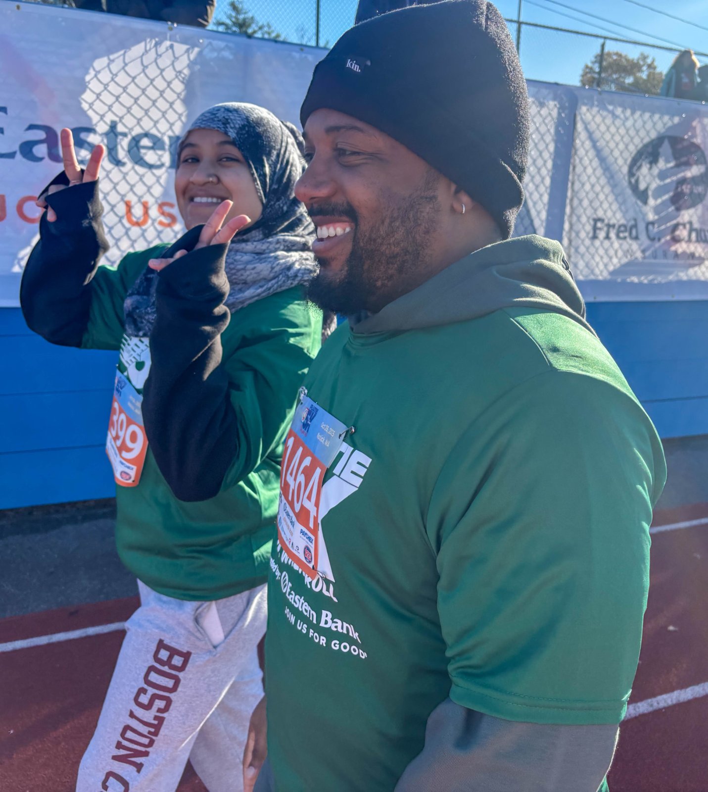 Two lab members smiling with race bibs at the Flutie 5K for Autism